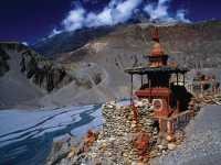 A temple perched high above a rugged valley in Upper Mustang |  Richard I'Anson